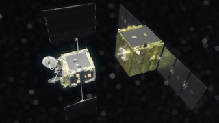 Two cube-shaped satellites rendezvous is black space. A visualization of the ELSA-M space junk collector and its target, a satellite from the OneWeb megaconstellation.