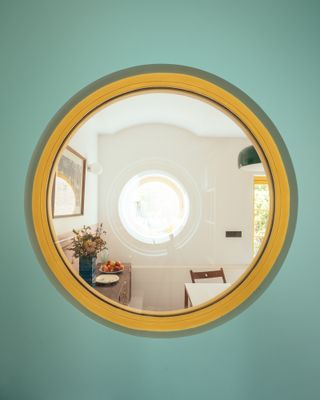 round window on light green wall