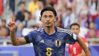 Takumi Minamino of Japan celebrates prior to the Iraq vs Japan live stream at the AFC Asian Cup