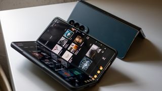 A Samsung Galaxy Z Fold 5 running YouTube Music next to a Greygreen Galaxy Z Fold 4