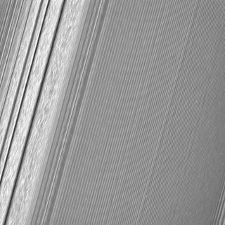 This Cassini image, taken Dec. 8, 2016, highlights Saturn's A ring, at left, and shows a density wave — a buildup of material that has formed from the pull of the moons Janus and Epimetheus. Clumpy perturbations called "straw" are also visible within that wave.