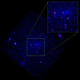 A dark image of two purple blobs in space.