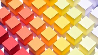 A gradient of colorful cubes, from dark red (left) to pale yellow (right)