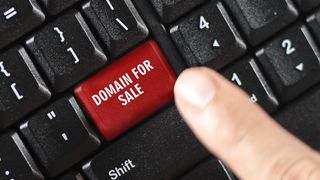 domain for sale words on red keyboard button