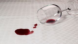 Spilled glass of red wine