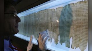 The Great Isaiah Scroll, one of the seven original Dead Sea Scrolls found in the late 1940s, on display at the Asia Society Hong Kong Center. In a new study, researchers determined that two scribes wrote this scroll.