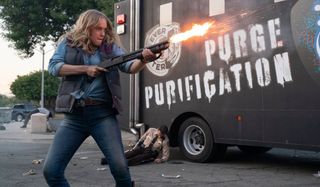 Leven Rambin firing a shotgun in The Forever Purge.