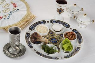 white seder plate with lamb bone