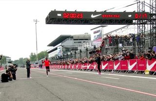 Eliud Kipchoge crosses the finish line with a time of 2:00:25 on May 6, 2017. Kipchoge was one of three athletes who attempted to run a marathon in less than 2 hours as part of Nike's Breaking2 project.