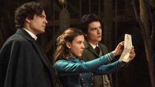 (L to R) Henry Cavill as Sherlock Holmes, Millie Bobby Brown as Enola Holmes, Louis Partridge as Tewkesbury in Enola Holmes 2.