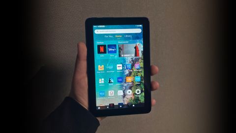 Amazon Fire 7 in the hand, displaying the homescreen