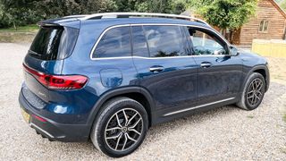 Mercedes-Benz EQB parked outside on gravel driveway