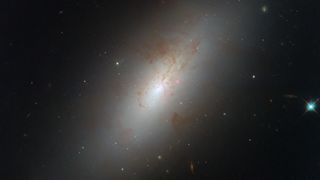 A lenticular galaxy called NGC 4694 captured by the Hubble Telescope 