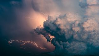 Huge thunderstorm cloud with lightning activity bursting out in all directions.