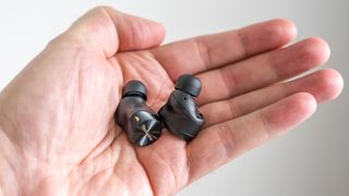 Technics EAH-AZ80 earbuds loose in hand.