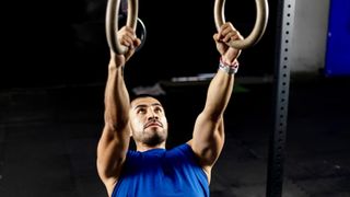 Australian pull-up using gym rings during back workout