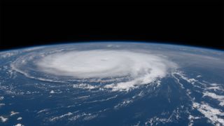 We see a huge hurricane over Earth in a photo taken from space.