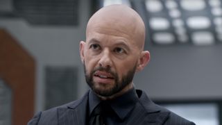 Jon Cryer's Lex Luthor looking at Batwoman on The Flash's Crisis on Infinite Earths