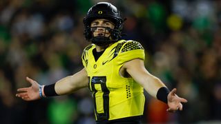 Bo Nix #10 of the Oregon Ducks celebrates a touchdown pass ahead of the Oregon vs Washington Pac-12 Championship game