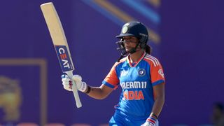 Harmanpreet Kaur of India reacts to her half-century during the 2024 Women's T20 Asia Cup match between India and the UAE at Rangiri Dambulla International Cricket Stadium on July 21, 2024 in Dambulla, Sri Lanka. 