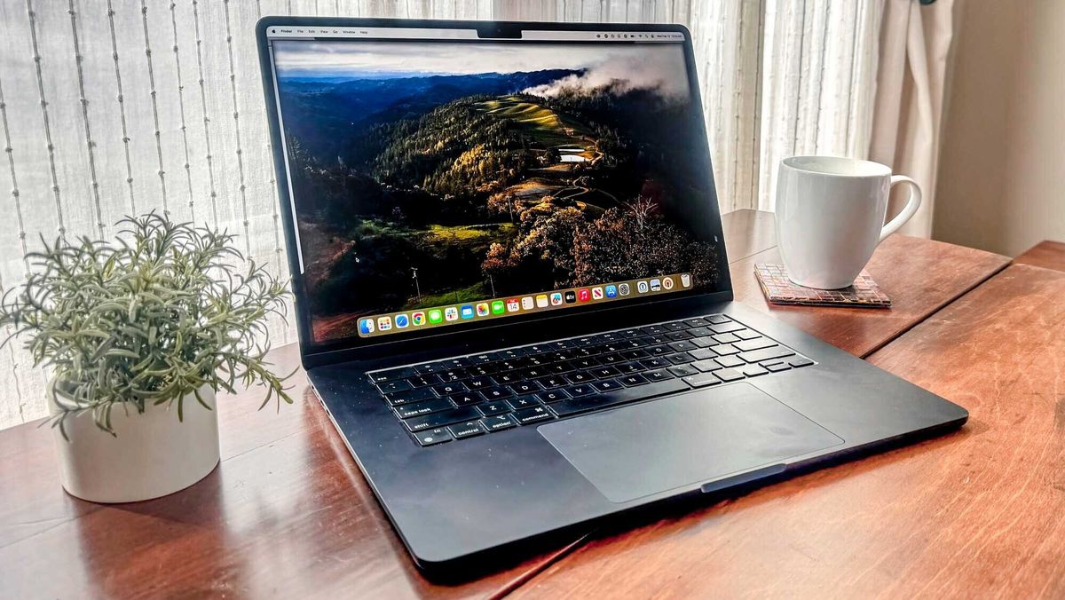 MacBook Air 15 M2 open at an angle on table in front of a window