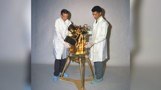 George Carruthers next to lunar telescope