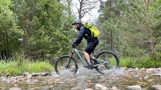 a photo riding a Yeti e-mountain bike with Shimano's EP8 motor