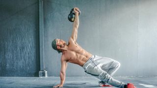 Man working out with a kettlebell