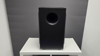 Nakamichi Dragon soundbar system subwoofer on white furniture