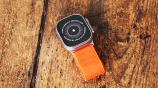 Apple Watch Ultra in use on wrist and on table