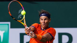 Rafael Nadal of Spain hits a backhand