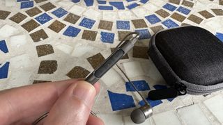 SoundMagic E80D wired USB-C hedaphones on grass and mosaic