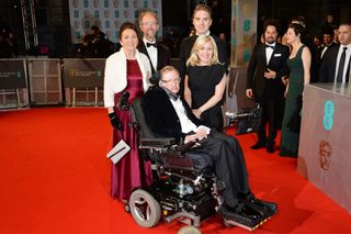 Stephen Hawking with Jane Wilde Hawking Jones (left) and guests attend the EE British Academy Film Awards at the Royal Opera House on Feb. 8, 2015, in London.