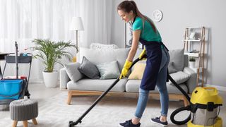 A professional cleaner vacuuming