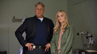 Mark Harmon and Emily Wickersham standing next to each other in the NCIS autopsy room