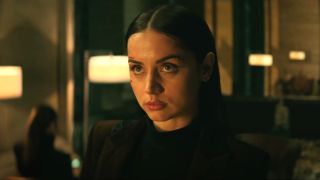 Ana de Armas looks up with a stoic face in From the World of John Wick: Ballerina.