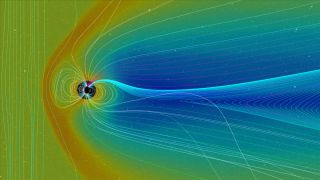 The giant magnetic field surrounding Earth changes shape due to the planet's north and south magnetic poles as well as the solar wind (the steady stream of particles coming from the sun).