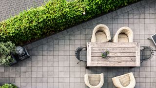 A patio with table and chairs from above