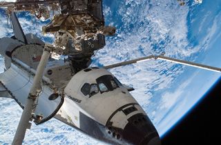 Space Shuttle Endeavour sits docked to the Destiny laboratory of the International Space Station during the STS-118 mission's third planned session of extravehicular activity (EVA).