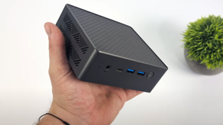 Edge's Phoenix Edge Z1 Mini PC held by ETA PRIME for scale in his (currently only-existing) benchmarking video.