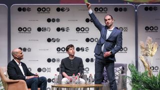 Sam Altman (C), US entrepreneur, investor, programmer, and founder and CEO of artificial intelligence company OpenAI, and the company's co-founder and chief scientist Ilya Sutskever (R), speak together at Tel Aviv University in Tel Aviv on June 5, 2023.