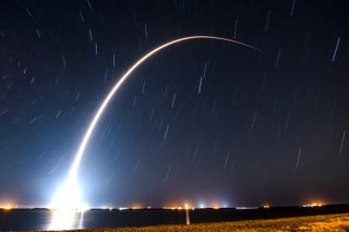 A SpaceX Falcon 9 rocket streaks into the predawn sky carrying 54 Gen2 Starlink internet satellites from Cape Canaveral Space Force Station in Florida on Dec. 28, 2022.