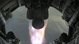 The three Merlin engines on SpaceX&#039;s SN11 prototype firing during the craft&#039;s test flight on March 30, 2021.