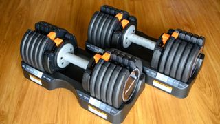 NordicTrack Select-a-Weight Adjustable Dumbbells on a wooden floor