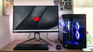 An iBUYPOWER Y60 custom-built PC sits on a desk next to a monitor displaying the iBUYPOWER logo