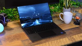 best laptops for engineering students: A Dell XPS 15 (2022) on a wooden desk