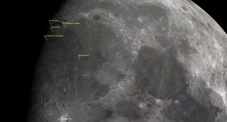 A closeup of the moon's surface showing a large crater.