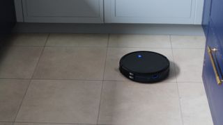 Eufy RoboVac 11S cleaning a tiled floor