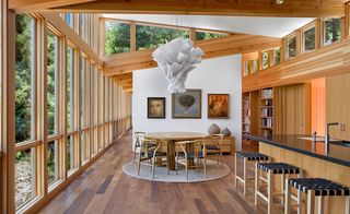 The kitchen and dining area featuring the Douglas Fir ceiling, sheetrock walls and ipe flooring