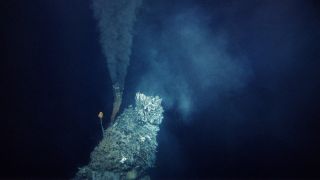 A deep-sea vent releasing fluid into the water